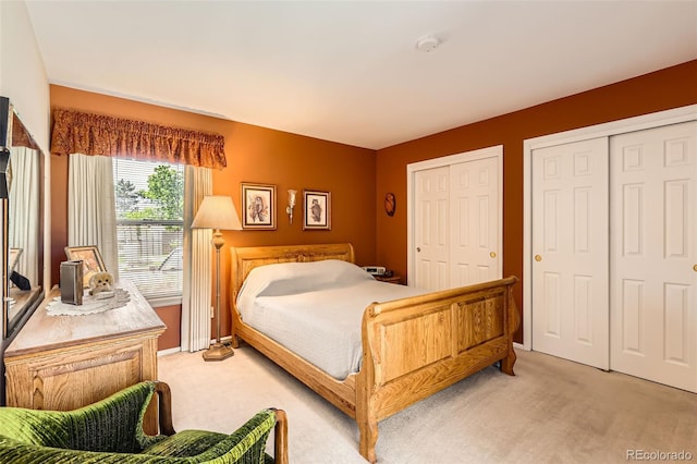 9925 W Progress Pl, Littleton, CO 80123 - bedroom featuring light colored carpet and multiple closets