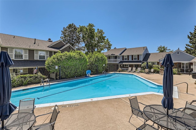 9925 W Progress Pl, Littleton, CO 80123 - community pool featuring a patio