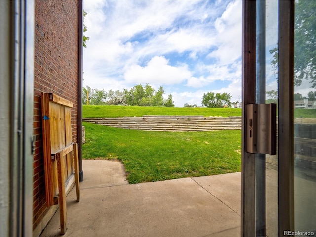 14590 E 2nd Ave Unit 105B, Aurora, CO 80011 - view of green lawn with a patio area and a view of rural / pastoral area