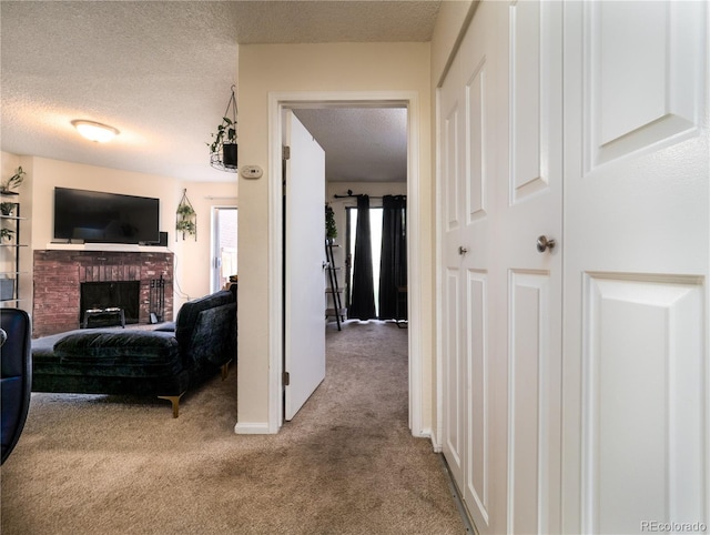 14590 E 2nd Ave Unit 105B, Aurora, CO 80011 - corridor with carpet and a textured ceiling