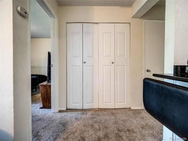 14590 E 2nd Ave Unit 105B, Aurora, CO 80011 - home office featuring carpet floors and a textured ceiling