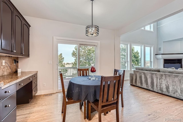 dining area featuring light wood-type flooring