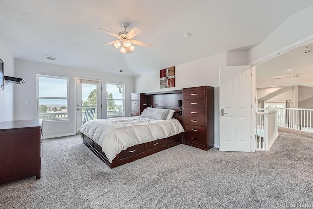 carpeted bedroom with vaulted ceiling, access to exterior, and ceiling fan