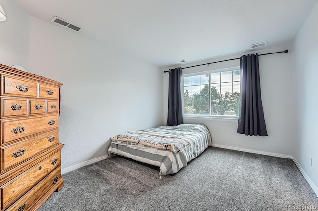 bedroom with dark carpet