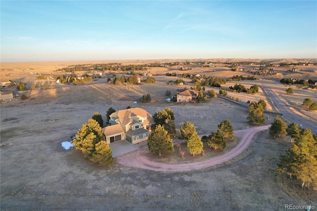 birds eye view of property featuring a rural view