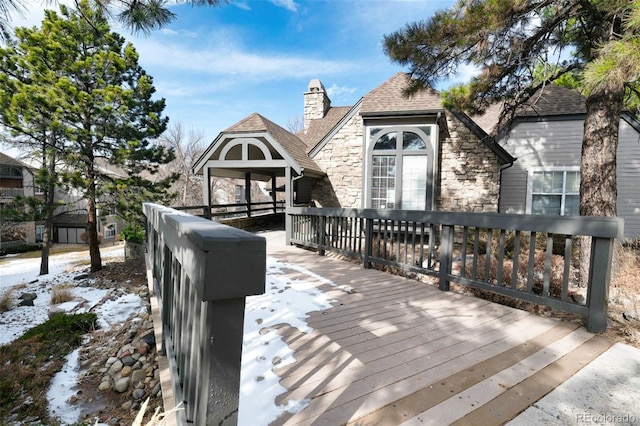 view of snow covered deck