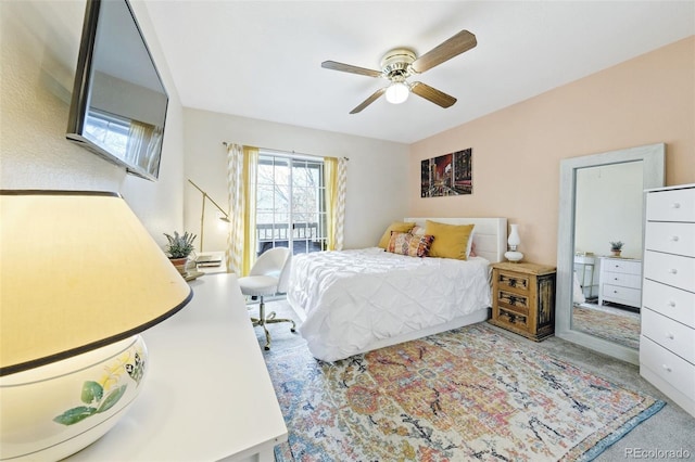 carpeted bedroom featuring ceiling fan