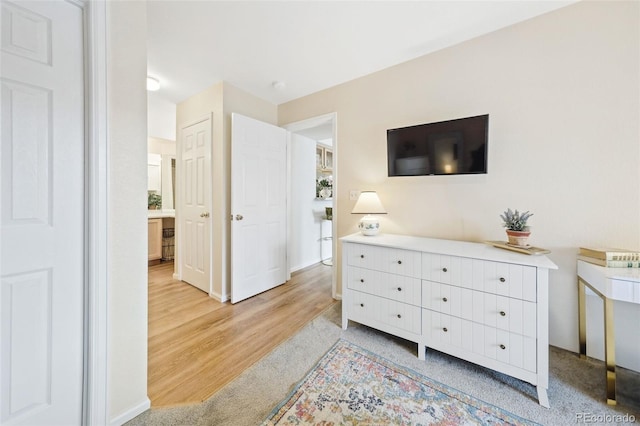 bedroom with light wood finished floors