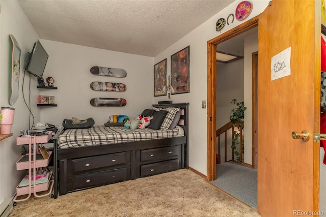 carpeted bedroom featuring a textured ceiling