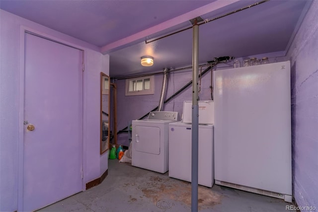 laundry area featuring washing machine and clothes dryer