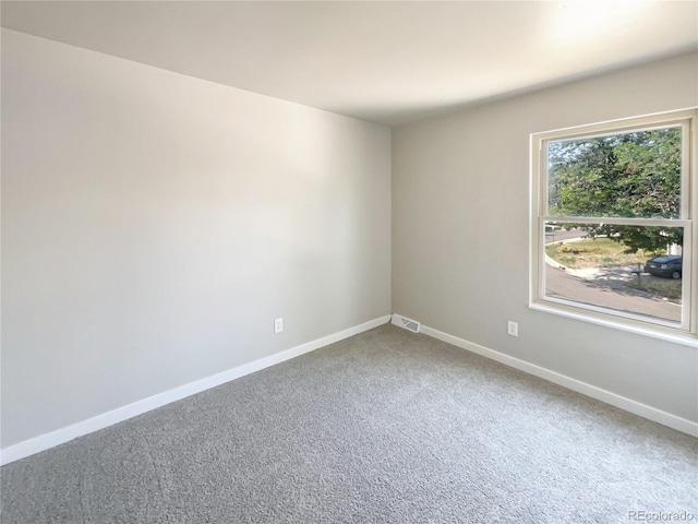 unfurnished room with carpet flooring