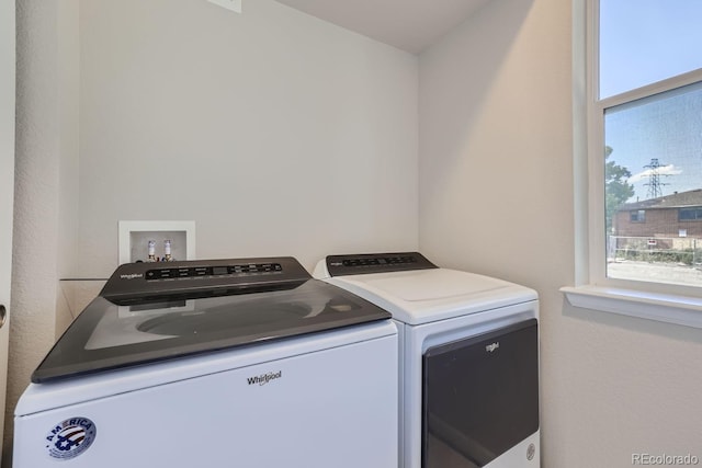 laundry area with separate washer and dryer