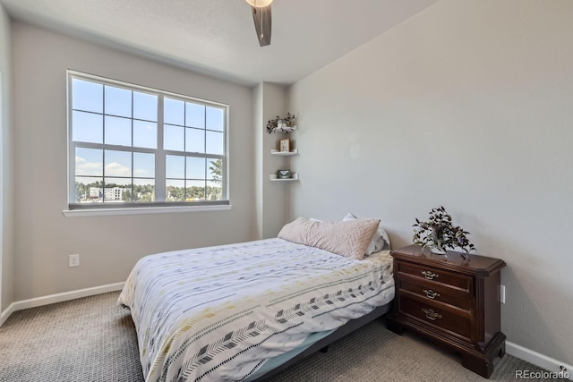 bedroom with ceiling fan and carpet flooring