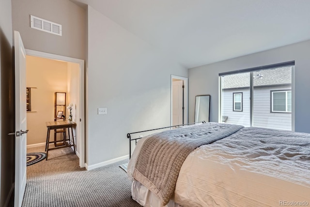 bedroom featuring vaulted ceiling and carpet