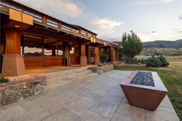 6455 Dakota Ridge Dr, Golden, CO 80403 - view of patio / terrace featuring an outdoor fire pit and a mountain view