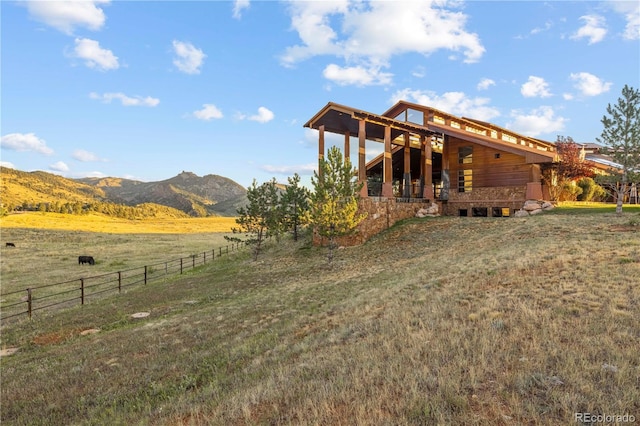6455 Dakota Ridge Dr, Golden, CO 80403 - back of house featuring a mountain view and a view of countryside
