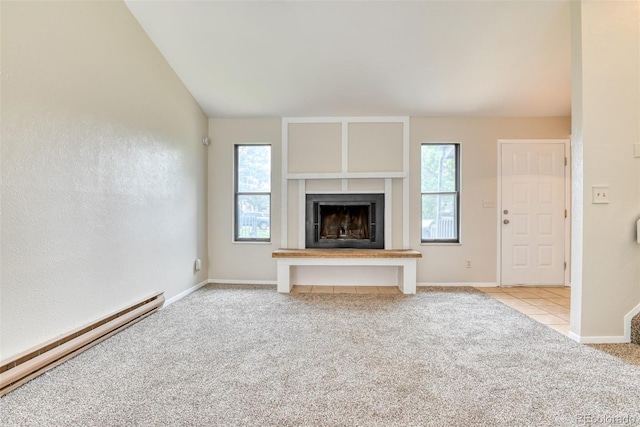 1419 Territory Trl, Colorado Springs, CO 80919 - unfurnished living room featuring carpet, a baseboard heating unit, plenty of natural light, a fireplace with raised hearth, and lofted ceiling