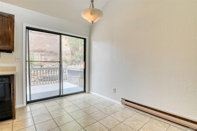 1419 Territory Trl, Colorado Springs, CO 80919 - unfurnished dining area with a baseboard radiator, vaulted ceiling, light tile patterned floors, and baseboards
