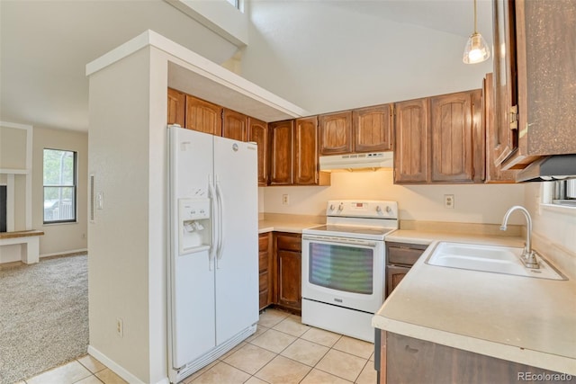 1419 Territory Trl, Colorado Springs, CO 80919 - kitchen featuring white appliances, under cabinet range hood, a sink, light tile patterned floors, and brown cabinetry