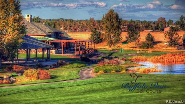 surrounding community with a gazebo, a lawn, and a water view