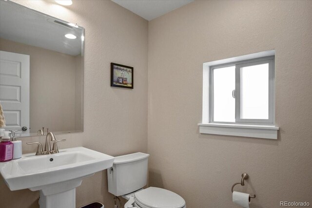 2521 Moline St, Aurora, CO 80010 - bathroom featuring toilet and a sink