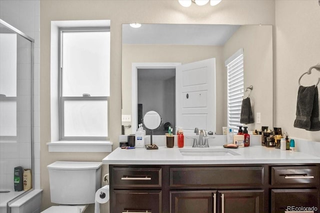 2521 Moline St, Aurora, CO 80010 - bathroom with a shower with door, toilet, and vanity