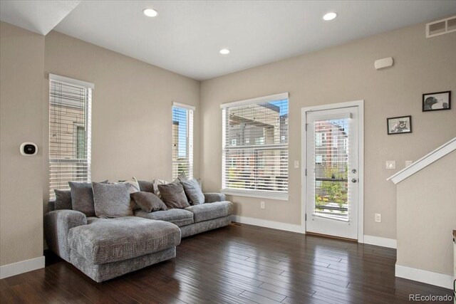 2521 Moline St, Aurora, CO 80010 - living area with plenty of natural light, baseboards, and recessed lighting