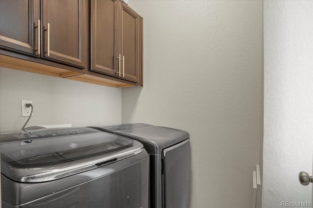 2521 Moline St, Aurora, CO 80010 - clothes washing area featuring cabinet space and independent washer and dryer