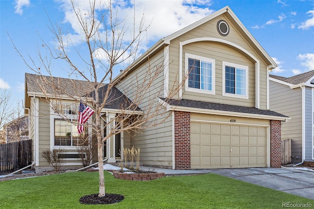 traditional home with a garage, brick siding, fence, driveway, and a front yard