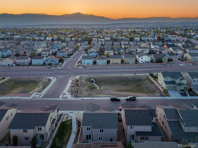 aerial view at dusk with a mountain view