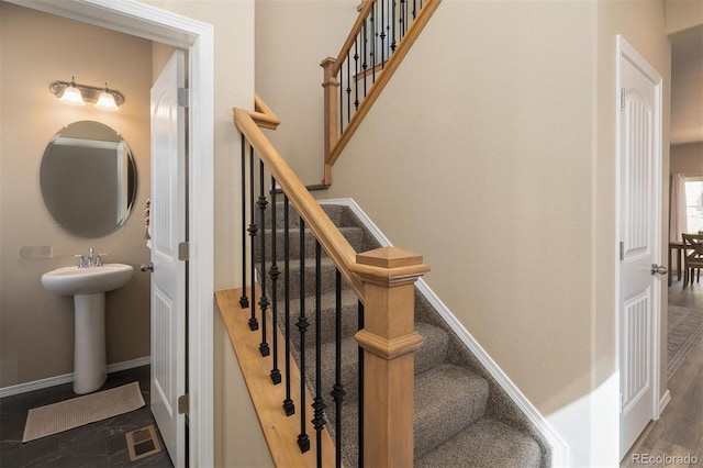 stairway featuring hardwood / wood-style floors