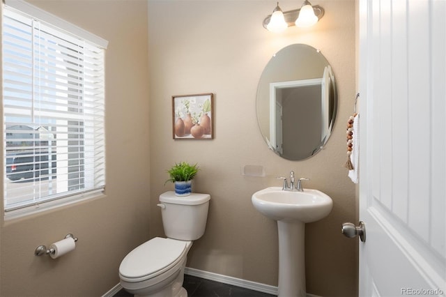 bathroom with sink, tile patterned flooring, and toilet