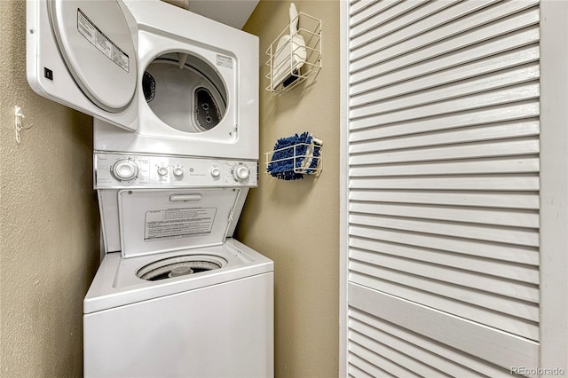 laundry room featuring stacked washing maching and dryer