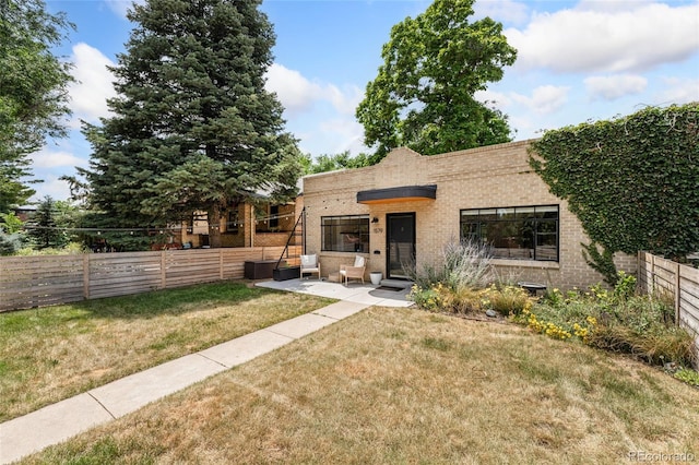 1579 Fairfax St, Denver, CO 80220 - view of front of property featuring brick siding and a fenced backyard