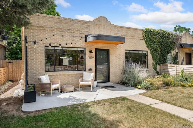 1579 Fairfax St, Denver, CO 80220 - view of front of home featuring brick siding and a patio area