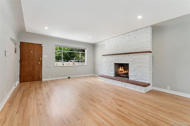 1579 Fairfax St, Denver, CO 80220 - unfurnished living room featuring light wood finished floors, a fireplace, and recessed lighting