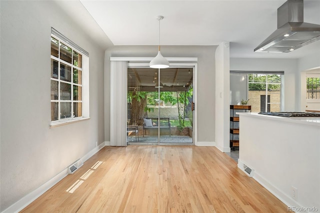 1579 Fairfax St, Denver, CO 80220 - unfurnished dining area with wood finished floors and baseboards