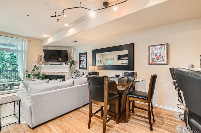 3030 Wyandot St Unit 7, Denver, CO 80211 - living area with light wood-style floors and a fireplace