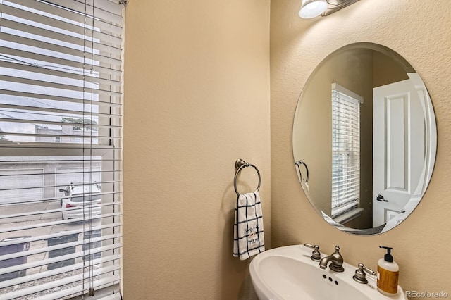 3030 Wyandot St Unit 7, Denver, CO 80211 - bathroom featuring a sink and a textured wall