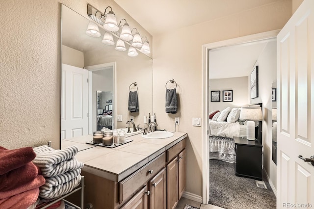 3030 Wyandot St Unit 7, Denver, CO 80211 - ensuite bathroom featuring vanity and a textured wall