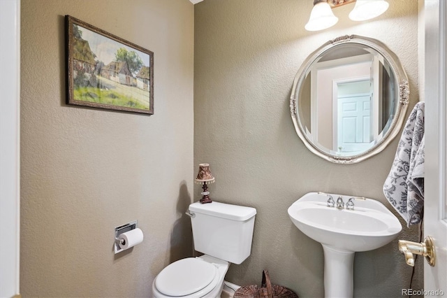 half bath featuring toilet