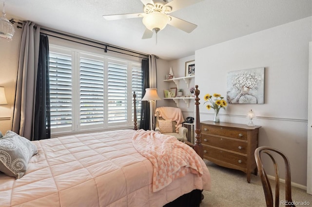 carpeted bedroom featuring a ceiling fan