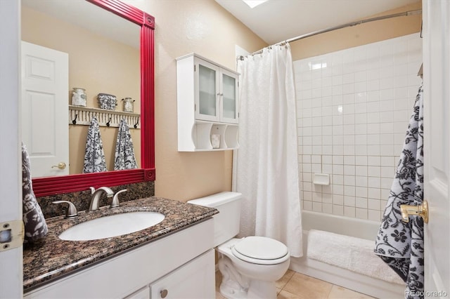 full bathroom with vanity, shower / tub combo with curtain, tile patterned floors, and toilet