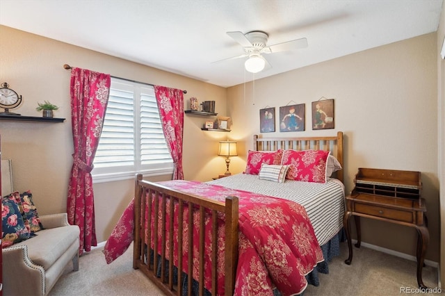 carpeted bedroom with baseboards and ceiling fan
