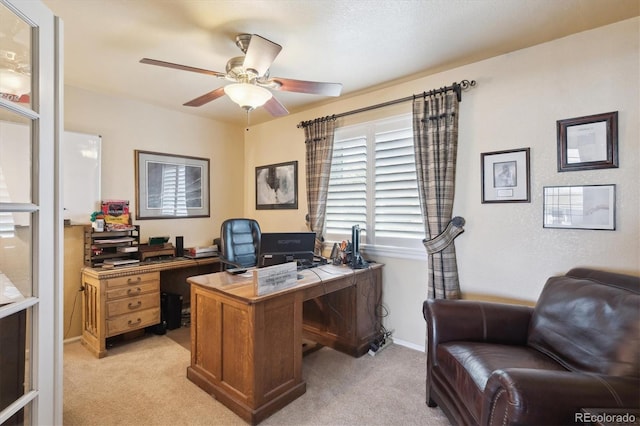 office with baseboards, ceiling fan, and light colored carpet