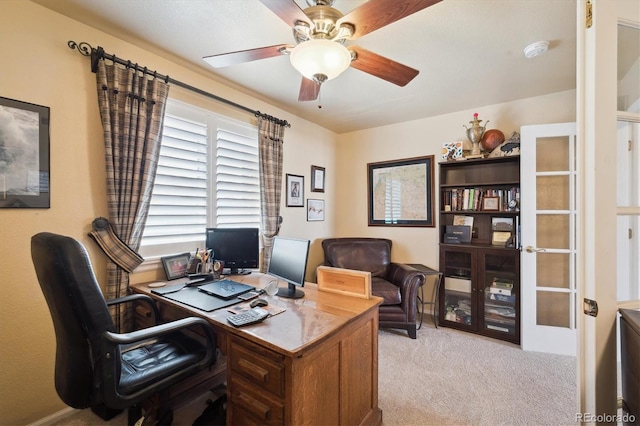 office area featuring a ceiling fan and carpet