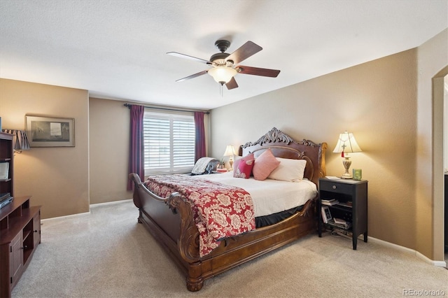 bedroom featuring baseboards, carpet, and a ceiling fan