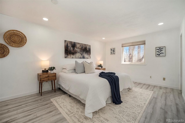 bedroom featuring recessed lighting, baseboards, and light wood-type flooring