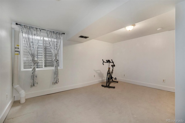 workout area with carpet flooring, baseboards, and visible vents