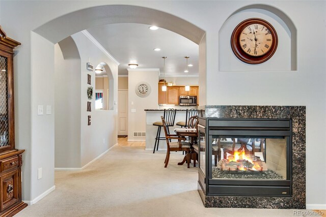 15501 E 112th Ave Unit 33D, Commerce City, CO 80022 - interior space with visible vents, arched walkways, baseboards, and light colored carpet